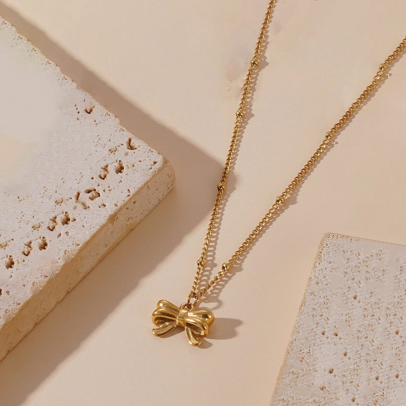 Jewels Galaxy Gold Plated Stainless Steel Anti Tarnish Bow Themed Pendant