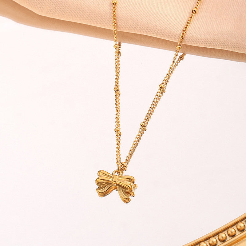 Jewels Galaxy Gold Plated Stainless Steel Anti Tarnish Bow Themed Pendant
