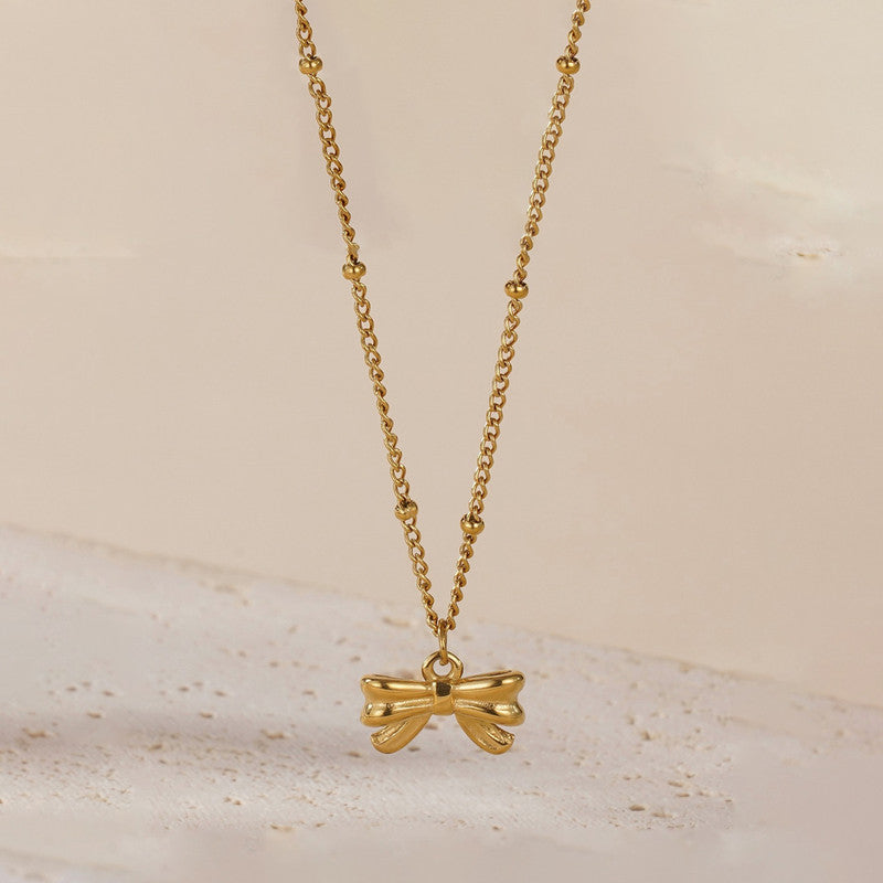 Jewels Galaxy Gold Plated Stainless Steel Anti Tarnish Bow Themed Pendant