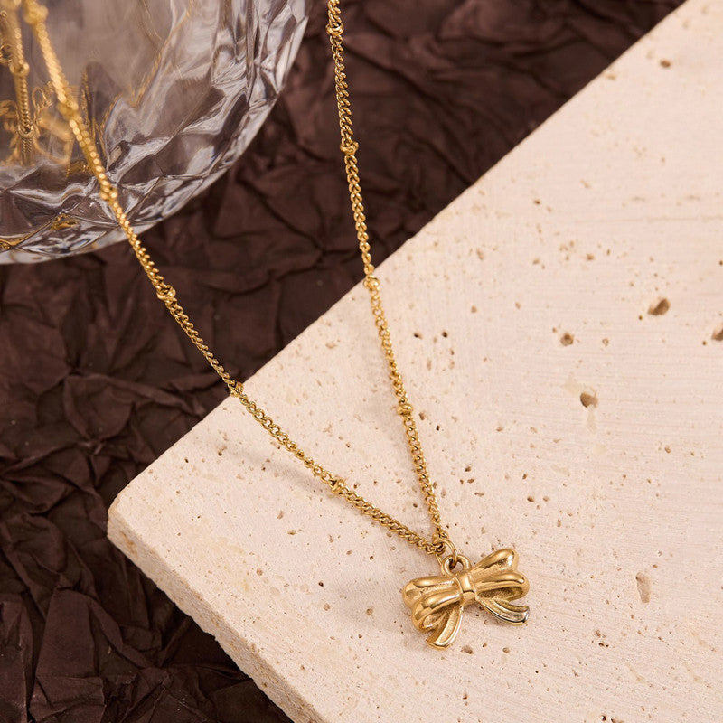 Jewels Galaxy Gold Plated Stainless Steel Anti Tarnish Bow Themed Pendant