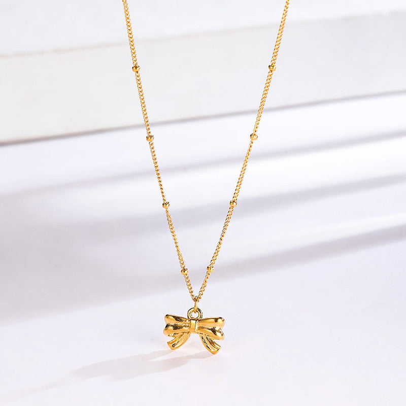 Jewels Galaxy Gold Plated Stainless Steel Anti Tarnish Bow Themed Pendant