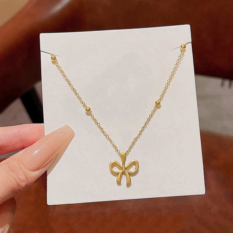 Jewels Galaxy Gold-Plated Anti Tarnish Stainless Steel Infinity Bow Pendant