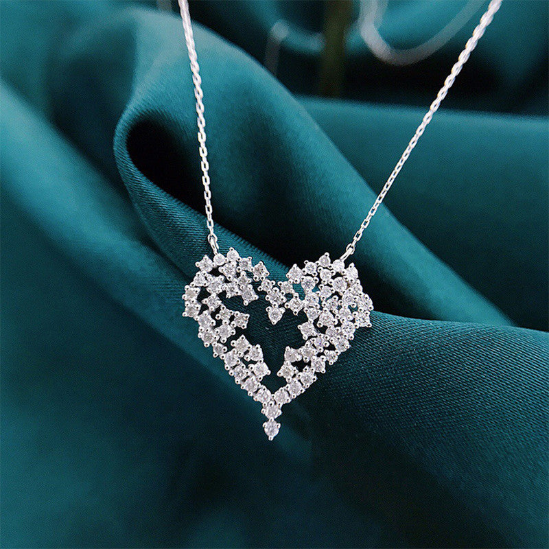 Jewels Galaxy Silver Plated American Diamond Studded Heart Themed Pendant