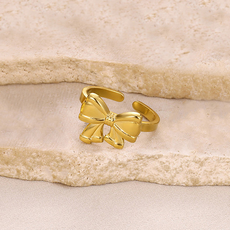 Jewels Galaxy Gold Plated Stainless Steel Anti Tarnish Bow Themed Adjustable Finger Ring For Women