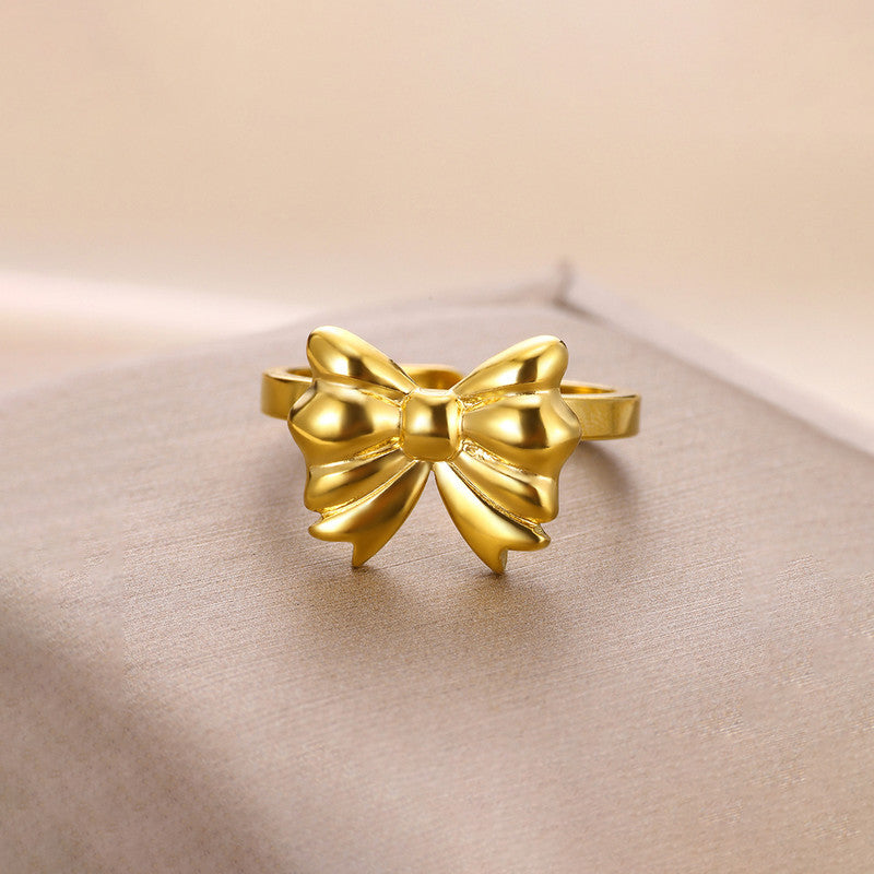 Jewels Galaxy Gold Plated Stainless Steel Anti Tarnish Bow Themed Adjustable Finger Ring For Women