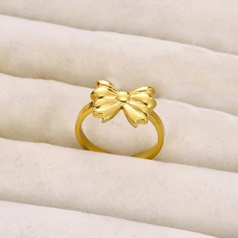 Jewels Galaxy Gold Plated Stainless Steel Anti Tarnish Bow Themed Adjustable Finger Ring For Women