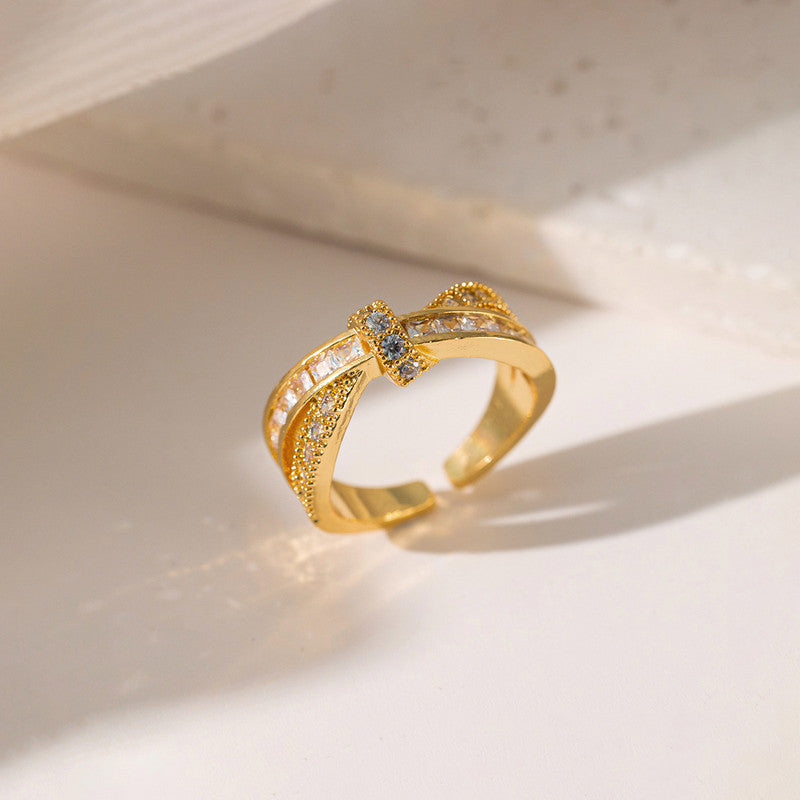 Jewels Galaxy Gold Plated Anti Tarnish Stainless Steel Cross Shaped Adjustable Finger Ring