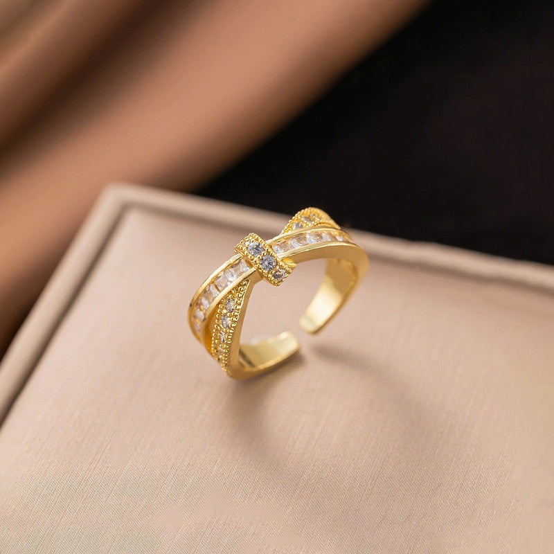 Jewels Galaxy Gold Plated Anti Tarnish Stainless Steel Cross Shaped Adjustable Finger Ring