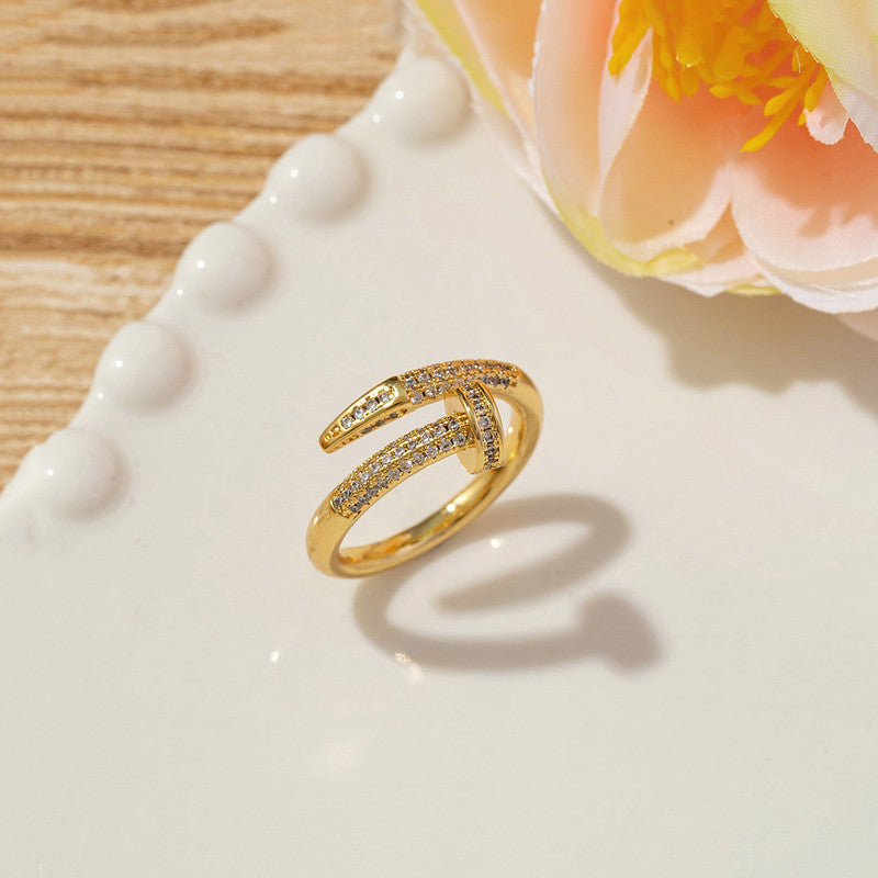 Jewels Galaxy Gold Plated Anti Tarnish Stainless Steel Nail Shaped AD Studded Adjustable Ring