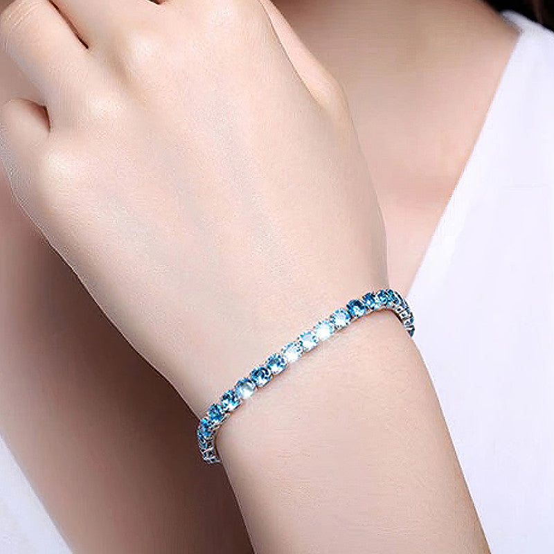 Jewels Galaxy Silver Plated Round Cut Cubic Zirconia Blue Matrix Anti Tarnish Tennis Bracelet