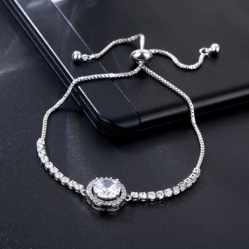 Jewels Galaxy Silver Plated Round Crystal Studded Matrix Anti Tarnish Tennis Bracelet