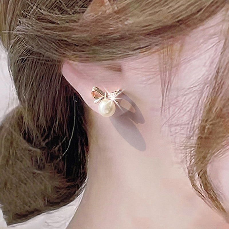 Jewels Galaxy Gold Plated American Diamond Studded Bow-Tie Shape Korean Stud Earrings