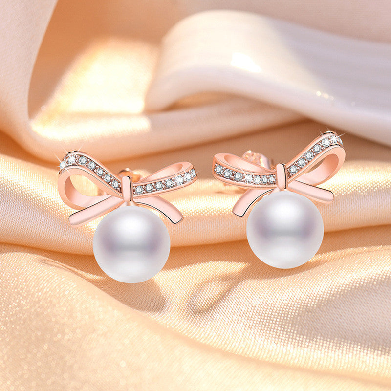 Jewels Galaxy Rose Gold Plated American Diamond Studded Bow-Tie Shape Korean Stud Earrings