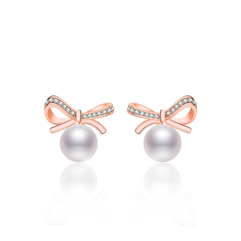 Jewels Galaxy Rose Gold Plated American Diamond Studded Bow-Tie Shape Korean Stud Earrings