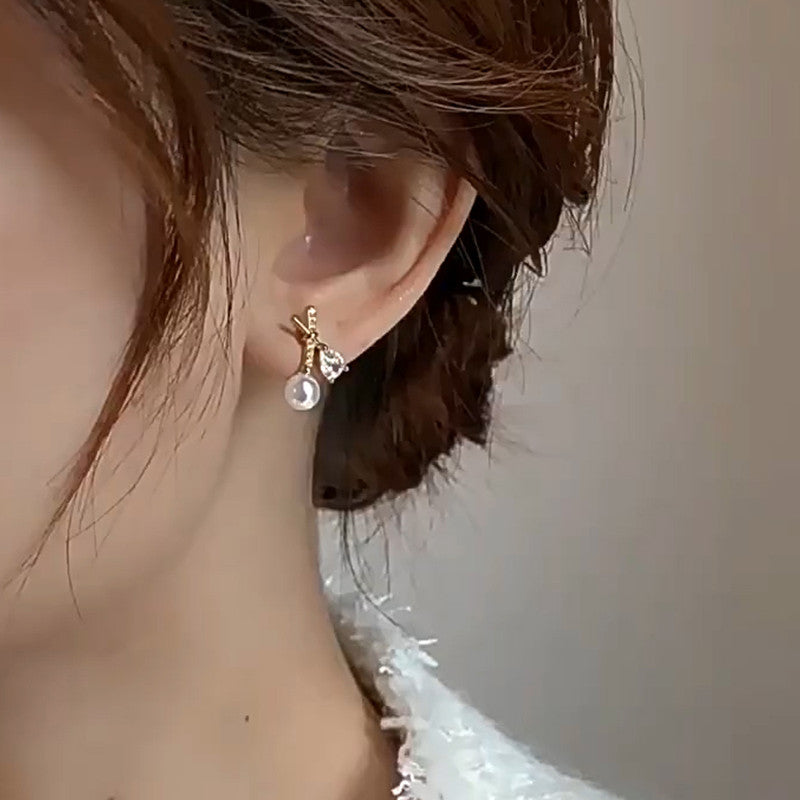 Jewels Galaxy Gold Plated American Diamond Studded Cross Shape Korean Stud Earrings