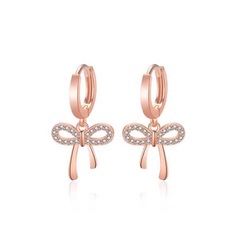 Jewels Galaxy Rose Gold Plated American Diamond Studded Bow-Tie Shape Korean Stud Earrings
