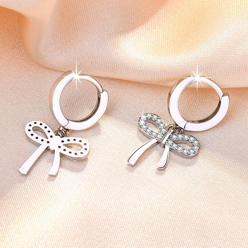 Jewels Galaxy Silver Plated American Diamond Studded Bow-Tie Shape Korean Stud Earrings