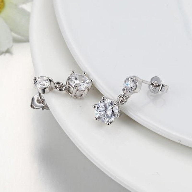 Jewels Galaxy Silver Plated American Diamond Studded Hexagon Shape Korean Drop Earrings