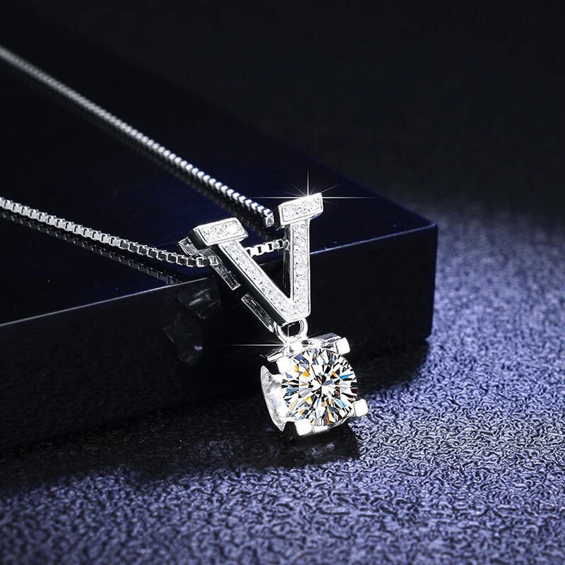 Jewels Galaxy Silver Plated Crystal Studded V Shape Circular Solitaire Pendant