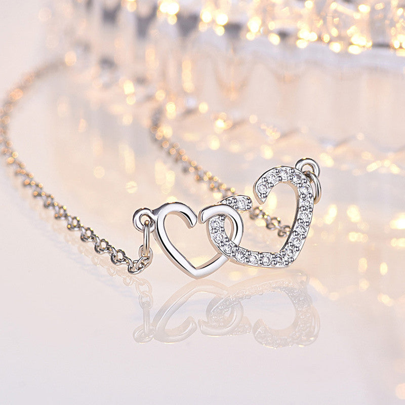 Jewels Galaxy Silver Plated American Diamond Studded Dual Heart Contemporary Korean Pendant