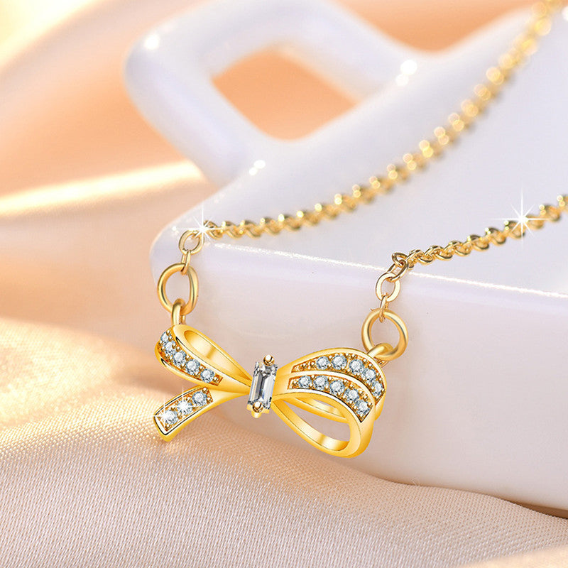 Jewels Galaxy Gold Plated American Diamond Studded Bow Like Contemporary Korean Pendant