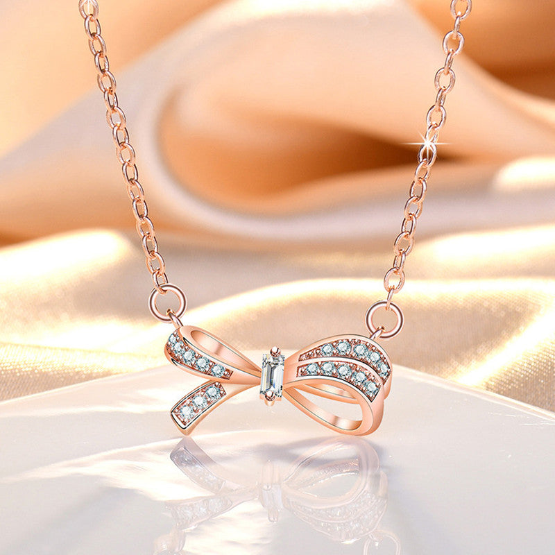 Jewels Galaxy Rose Gold Plated American Diamond Studded Bow Like Contemporary Korean Pendant