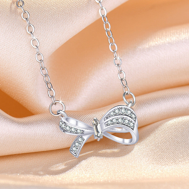 Jewels Galaxy Silver Plated American Diamond Studded Bow Like Contemporary Korean Pendant