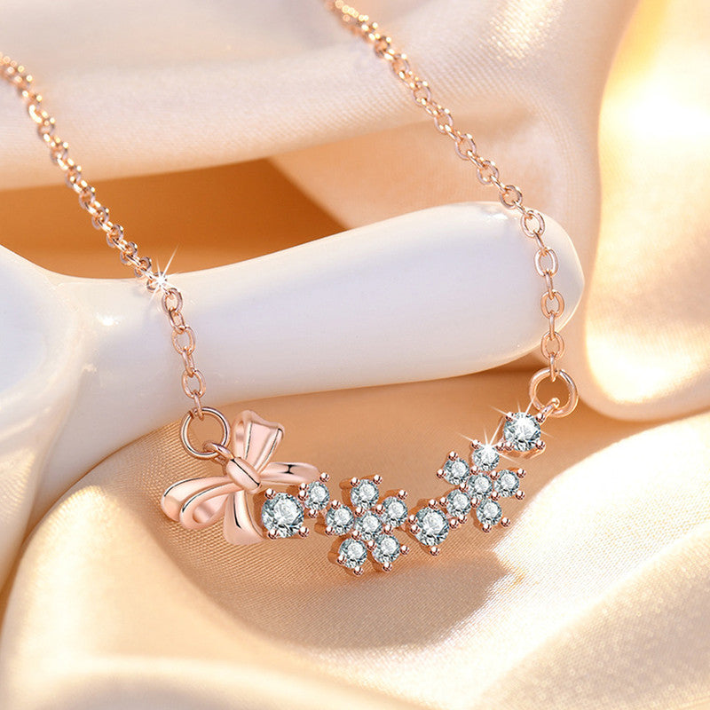 Jewels Galaxy Rose Gold Plated American Diamond Studded Bow-Tie Themed Contemporary Pendant