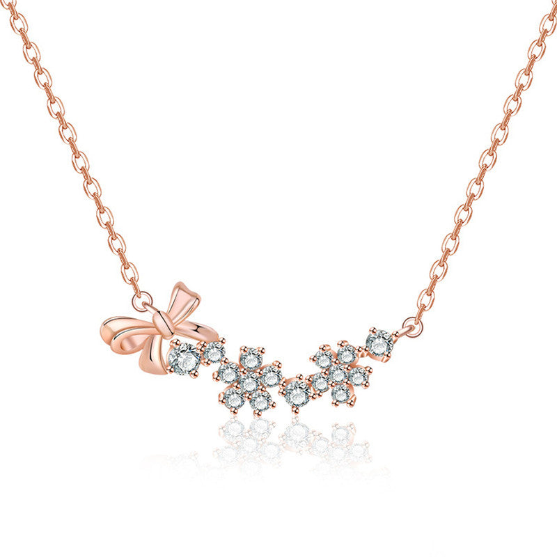 Jewels Galaxy Rose Gold Plated American Diamond Studded Bow-Tie Themed Contemporary Pendant