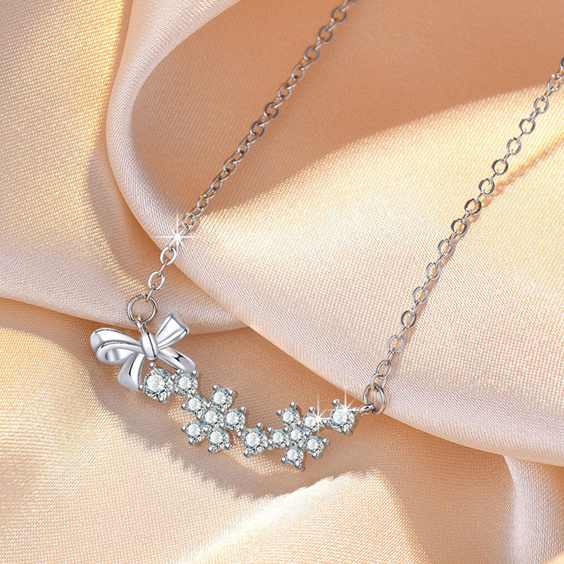Jewels Galaxy Silver Plated American Diamond Studded Bow-Tie Themed Contemporary Pendant