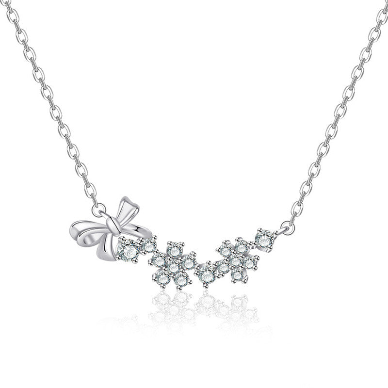 Jewels Galaxy Silver Plated American Diamond Studded Bow-Tie Themed Contemporary Pendant