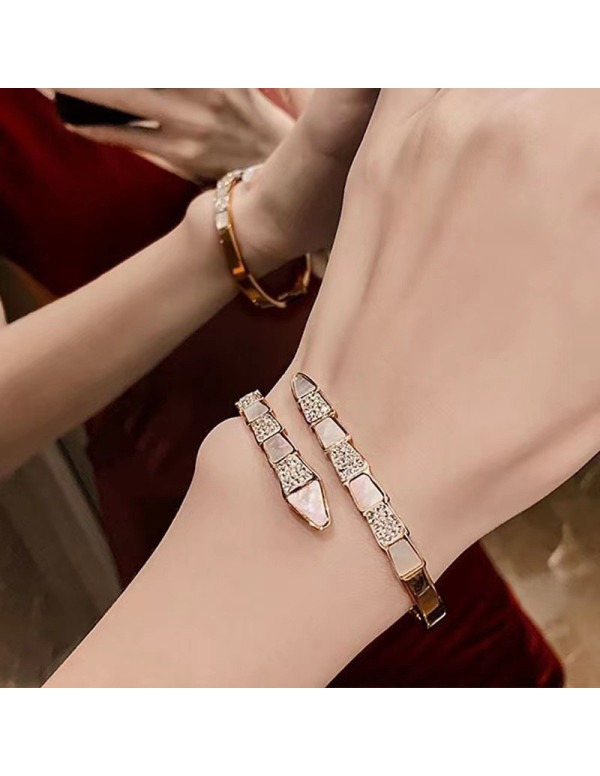 Jewels Galaxy Stainless Steel Rose Gold Plated Mother Of Pearl Snake Styled AD Studded Bracelet