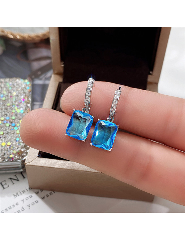 Jewels Galaxy Silver Plated Blue Rectangular American Diamond Studded Crushed Ice Cut Drop Earrings