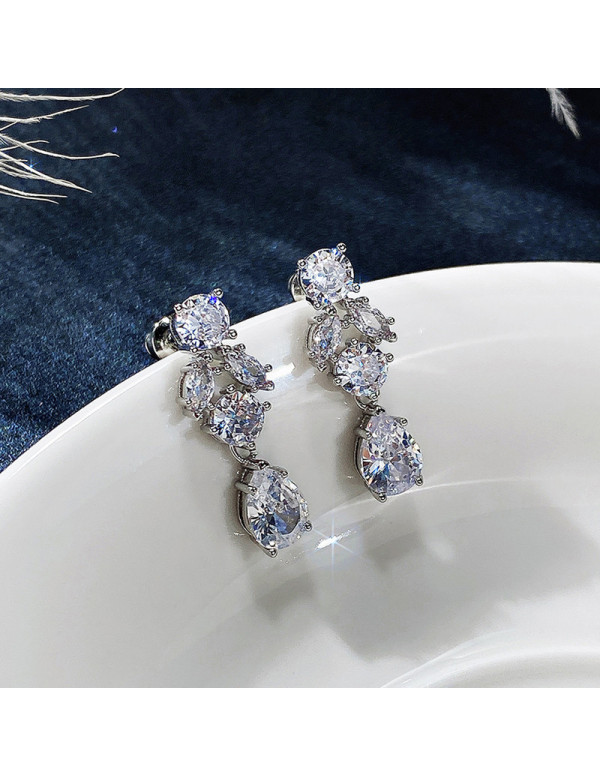 Jewels Galaxy Silver Plated American Diamond Studded Contemporary Crushed Ice Cut Drop Earrings