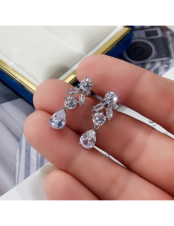 Jewels Galaxy Silver Plated American Diamond Studded Contemporary Crushed Ice Cut Drop Earrings