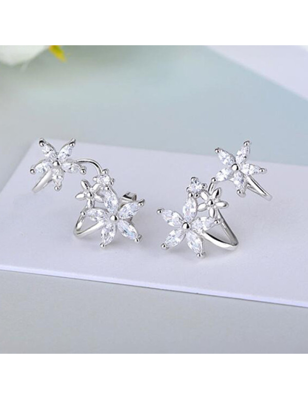 Jewels Galaxy Silver Plated American Diamond Studded Triple Star Shaped Earrings