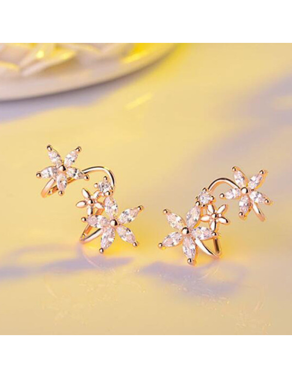 Jewels Galaxy Rose Gold Plated American Diamond Studded Triple Star Shaped Earrings