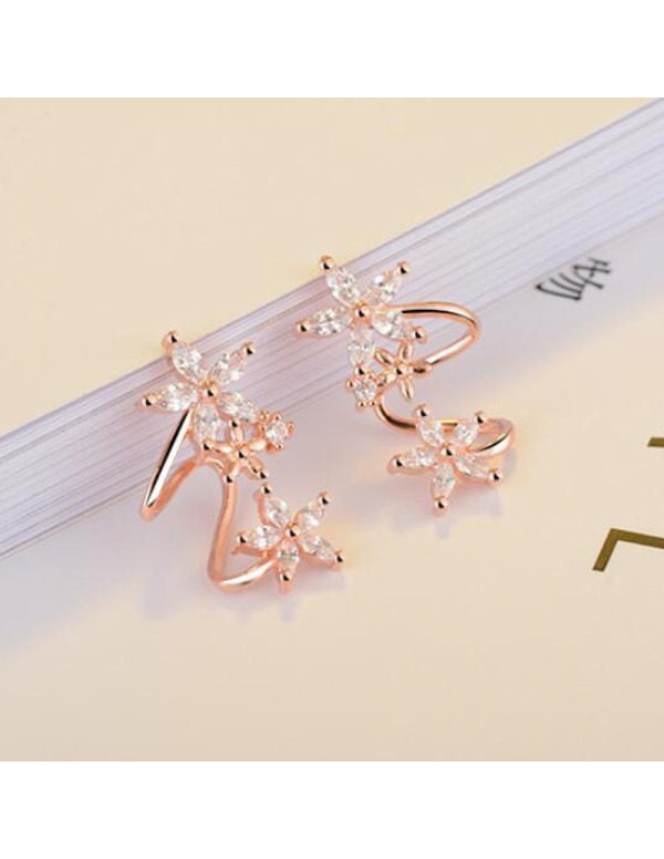 Jewels Galaxy Rose Gold Plated American Diamond Studded Triple Star Shaped Earrings