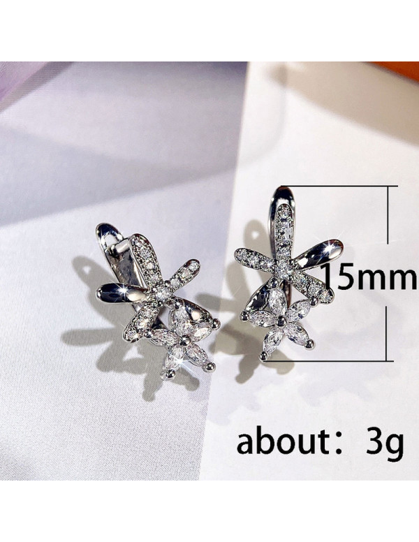 Jewels Galaxy Silver Plated American Diamond Studded Dual Star Shaped Earrings