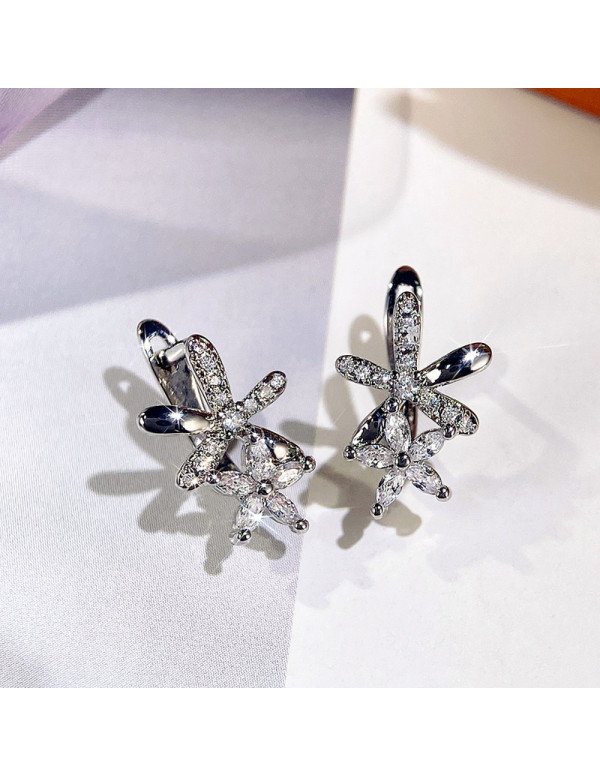 Jewels Galaxy Silver Plated American Diamond Studded Dual Star Shaped Earrings