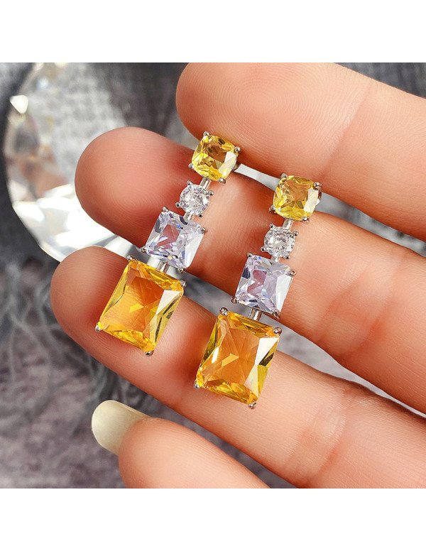 Jewels Galaxy Silver Plated AD Studded Yellow Geometrical Crushed Ice Cut Drop Earrings