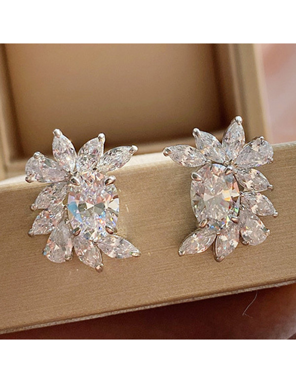 Jewels Galaxy Silver Plated American Diamond Studded Crushed Ice Cut Stud Earrings