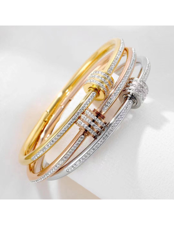 Jewels Galaxy Stainless Steel Gold, Rose Gold and Silver Plated American Diamond Studded Bangle Style Bracelet